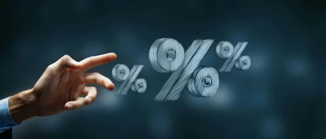 A hand gestures toward floating percentage symbols, highlighting savings on Swiss Private Medical Insurance.